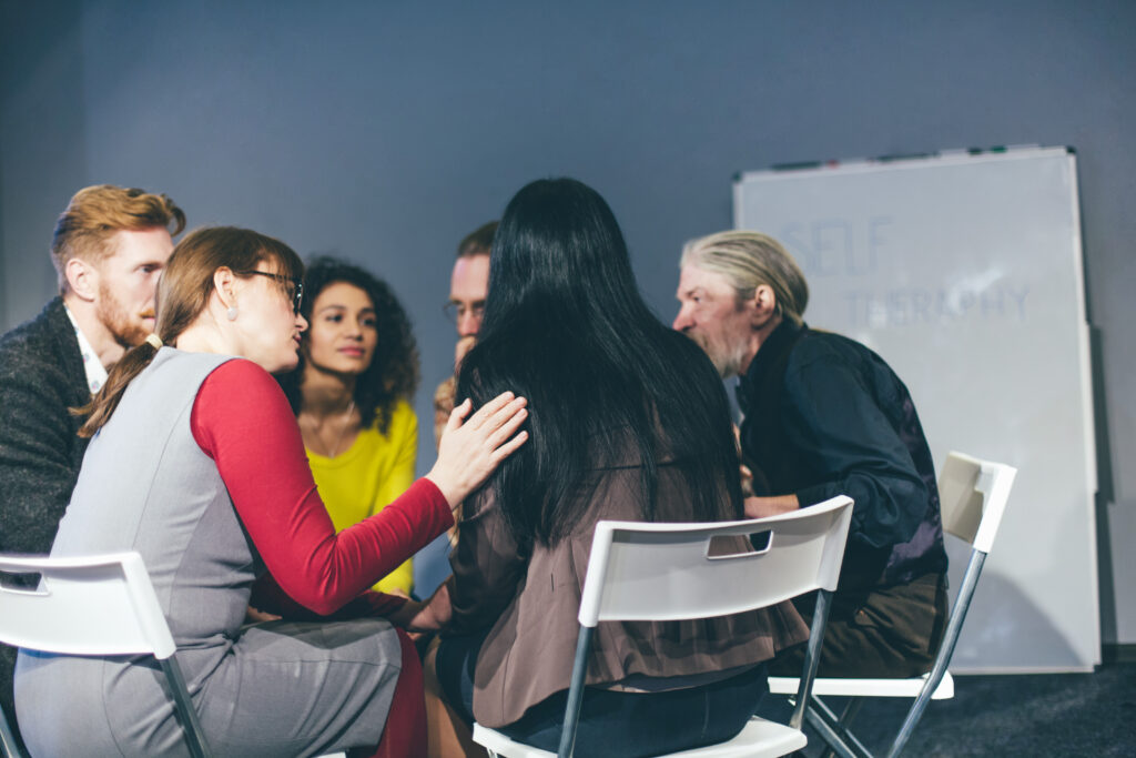 Group of individuals in a peer to peer support group for drug and alcohol abuse.